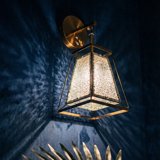 Decorative wall lamp casting shadows on a textured wall