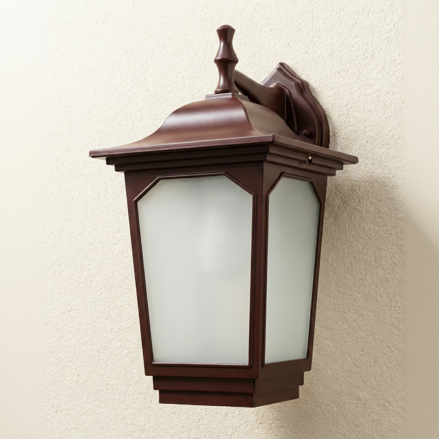 Brown outdoor wall light fixture on a beige wall