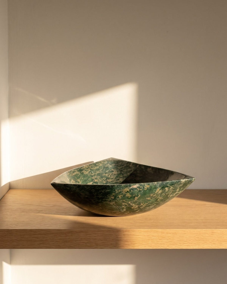 Emerald Speckle serpentine stone serving bowl on a sunlit wooden shelf